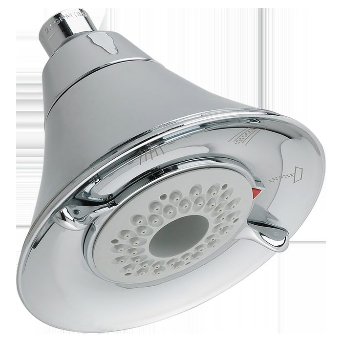 A chrome showerhead is mounted, with multiple water outlet holes. It emits water in a bathroom setting, designed for efficient water distribution.