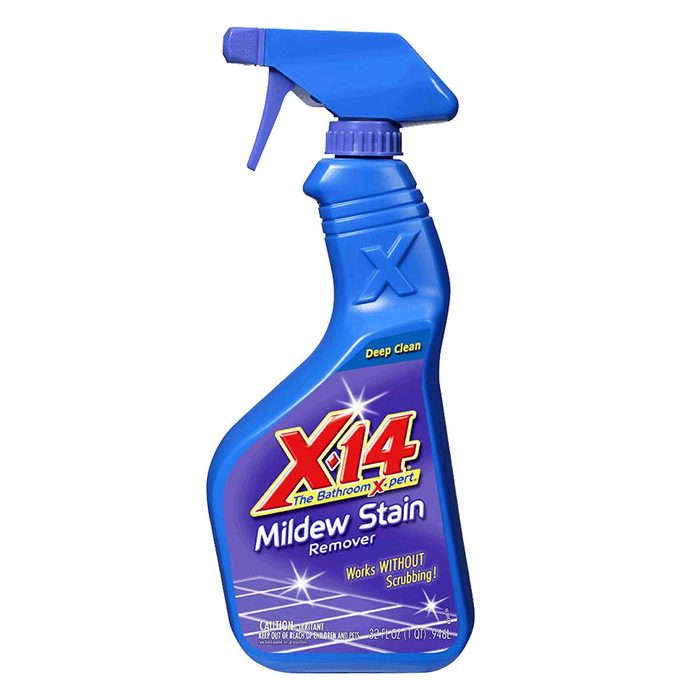 A spray bottle of X14 Mildew Stain Remover is positioned upright. It's designed to clean surfaces without scrubbing, ideal for bathroom use.