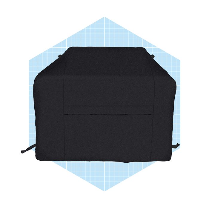 A black outdoor furniture cover sits flat, protecting the furniture below, against a light blue grid background, emphasizing its shape and texture.