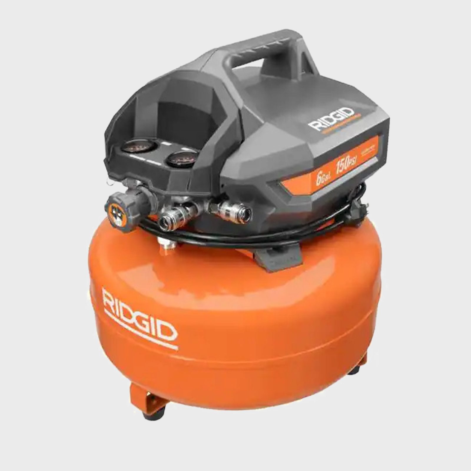 A portable air compressor sits on wheels, powering tools. It features a gray top unit with pressure gauges and connections, above an orange tank.