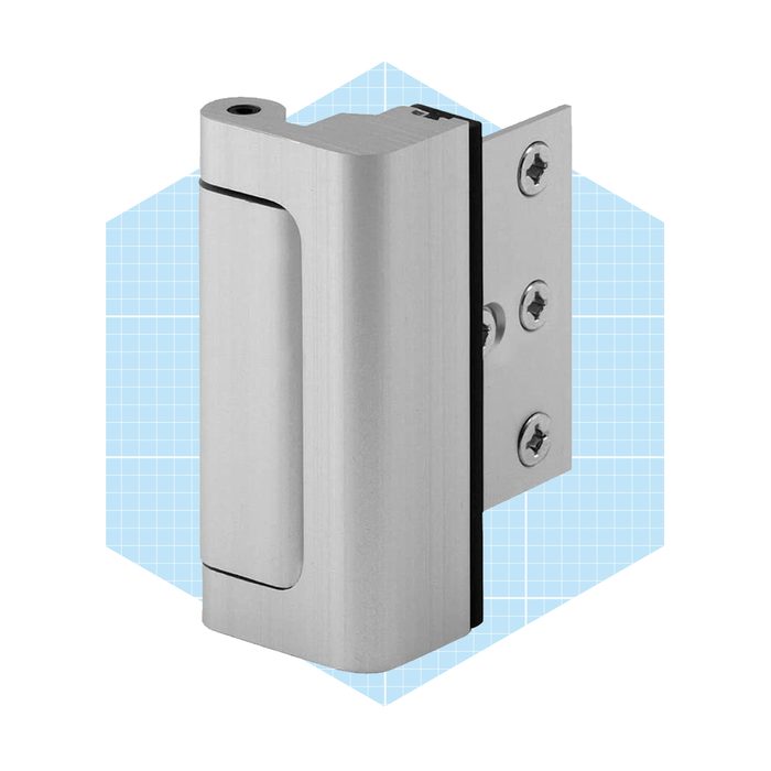 A metal door hinge secures a door, allowing it to pivot smoothly. It is positioned against a light blue grid background.
