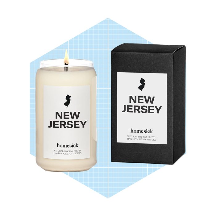 A white candle labeled 